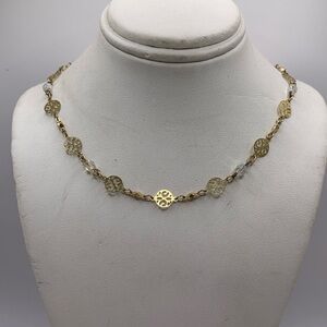 Gold Station Necklace with Intricate Design Gold Tone Pieces and Crystal Accents